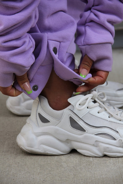 Purple sweat pants with adjustable ankle snaps